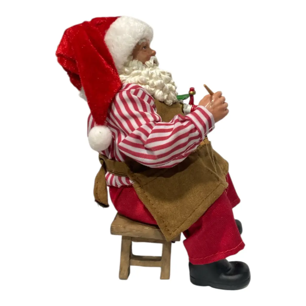 NOEL PINTOR EN BANCO 12X13X20CM